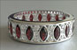 marquise cut ruby, round brilliant cut diamond, vintage style diamond band