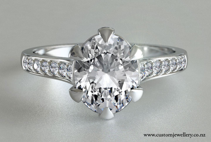 Oval Cut 1.5ct Diamond Ring with Small Diamonds on Claws