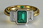 Yellow Gold Emerald Cut Emerald and Diamond Three Stone Bezel Set Ring