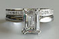 Emerald Cut Diamond Solitaire Engagement Ring with Princess Cut Diamond Band