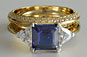 Asscher Sapphire and Trillion Three-stone Diamond Engagement Ring in Yellow Gold