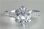 Oval Cut 1.5ct Diamond Ring with Small Diamonds on Claws